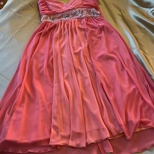 beautiful coral dress with rhinestones at the waist